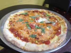 Pizza perfection topped with fresh cut basil and a savory blend of cheeses. Craig Nelson, 2014.