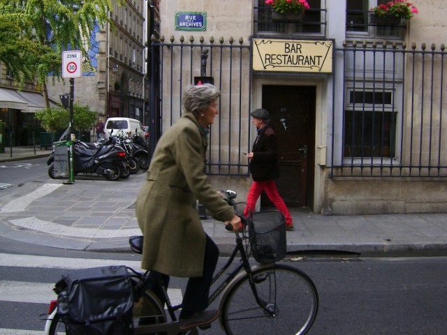 Biking along Rue de Archives. Photo: Craig Nelson